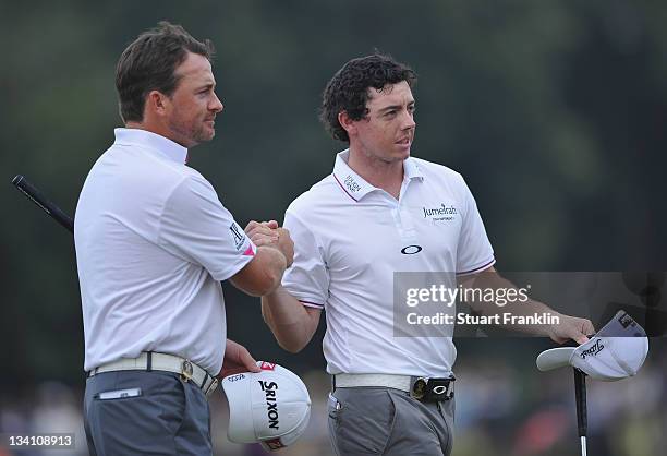 Rory McIlroy and Graeme McDowell of Ireland celebrate together during the third days fourballs at the Omega Mission Hills World Cup at the Mission...