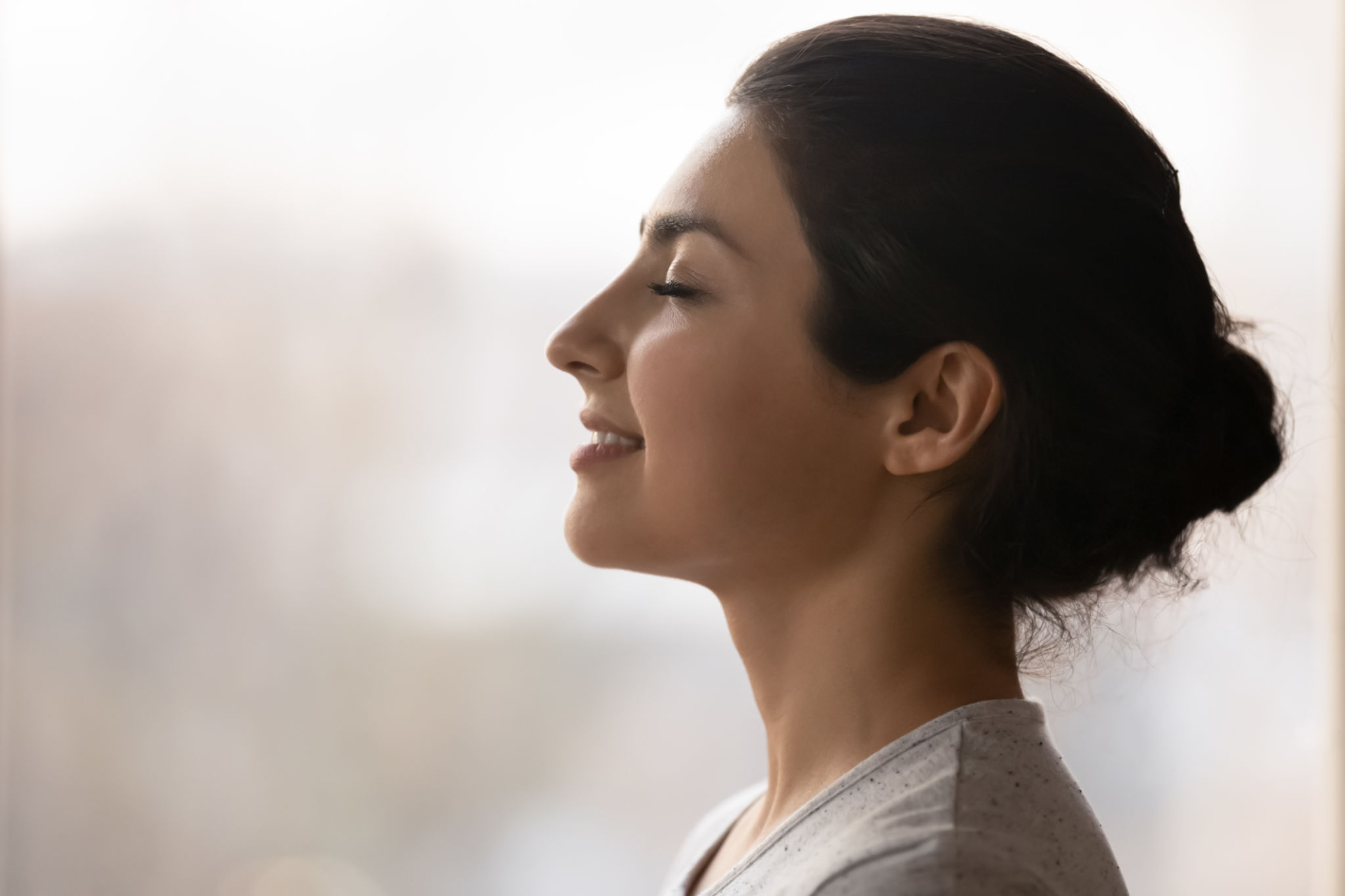 Calm millennial indian lady breath deep meditate with closed eyes Calm millennial indian lady breath deep meditate with closed eyes