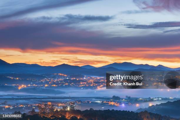 symphony of sunlight and magical of the fog in the dreaming city at dawn - dalat stock pictures, royalty-free photos & images