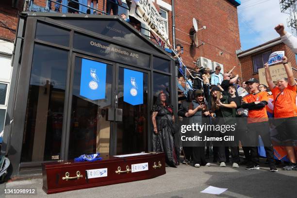 Coffin is seen outside the stadium as fans protest against Oldham Athletic owner Abdallah Lemsagem prior to the Sky Bet League Two match between...