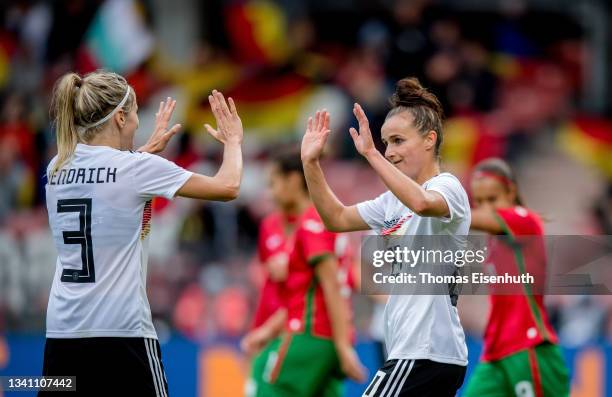 Lina Magull of Germany celebrates with Kathrin Hendrich after scoring her team's third goal during the FIFA Women's World Cup 2023 Qualifier group H...