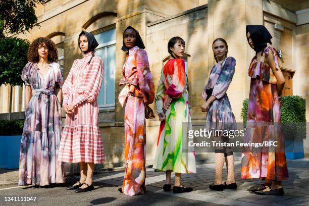 Models pose during the Anna Mason Presentation during London Fashion Week September 2021 on September 18, 2021 in London, England.