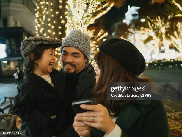 happy family having fun in the city during holidays. - happy holidays around the world stock pictures, royalty-free photos & images