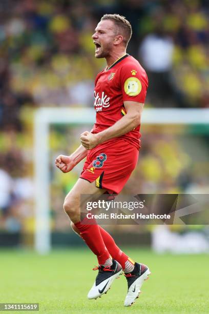 Tom Cleverley of Watford FC celebrates their team's third goal during the Premier League match between Norwich City and Watford at Carrow Road on...