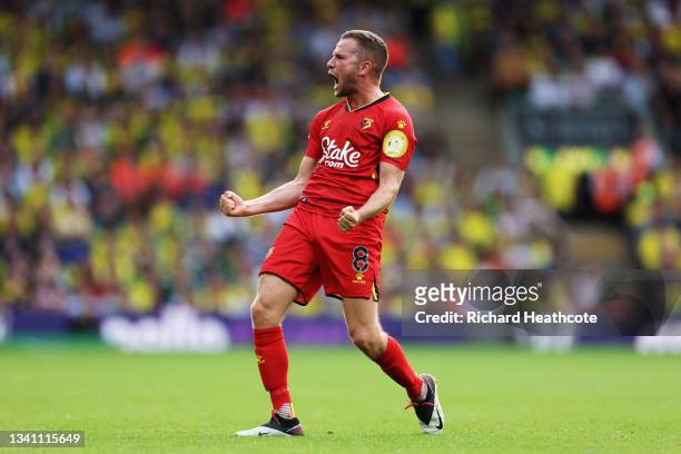 Tom Cleverley of Watford FC celebrates their team's third goal during the Premier League match between Norwich City and Watford at Carrow Road on...