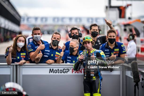 Moto3 rider Niccolò Antonelli of Italy and Avintia VR46 with his team at parc ferme during the qualifying session of the MotoGP Gran Premio Octo di...