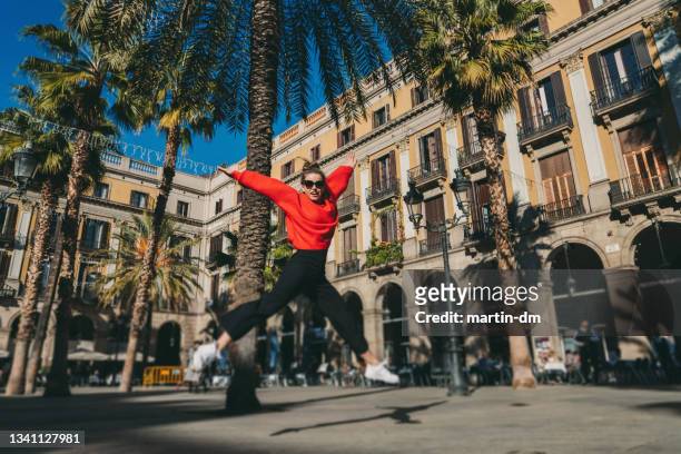 happy tourist woman in barcelona - winter barcelona stock pictures, royalty-free photos & images