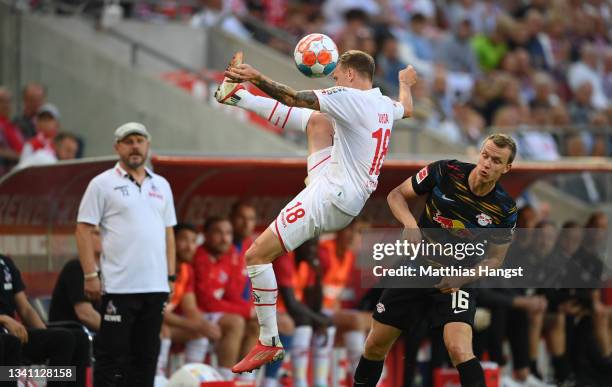 Ondrej Duda of 1. FC Köln controls the ball next to Lukas Klostermann of RB Leipzig during the Bundesliga match between 1. FC Köln and RB Leipzig at...