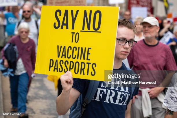 Protestors march through the city centre during a protest against vaccine passports on September 18, 2021 in Cardiff, Wales. First Minister of Wales...