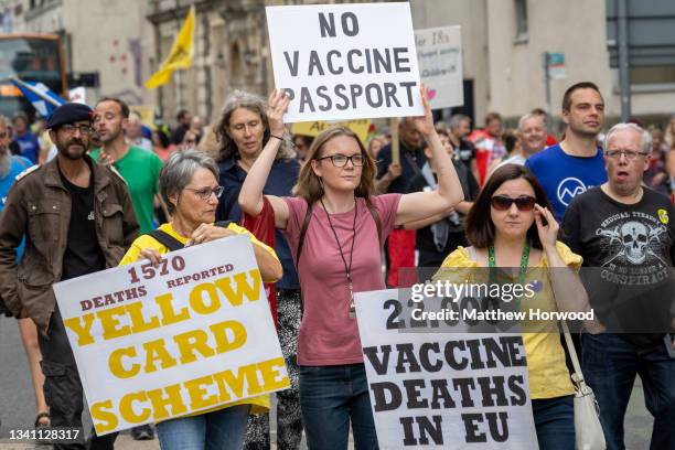 Protestors march through the city centre during a protest against vaccine passports on September 18, 2021 in Cardiff, Wales. First Minister of Wales...