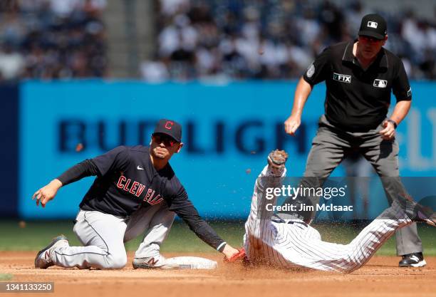 Gleyber Torres of the New York Yankees is caught stealing second base by Andres Gimenez of the Cleveland Indians during the second inning at Yankee...