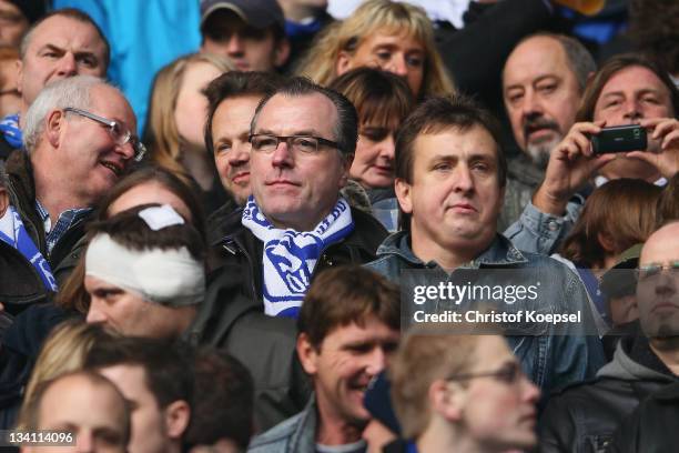 Clemens Toennies, chairman of the supervisory board of Schalke stands with the fans on the tribune during the Bundesliga match between Borussia...