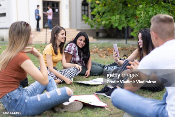 classmates learning in the schoolyard - hung stock pictures, royalty-free photos & images
