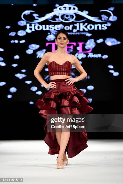 Model walks the runway for Eye on Fashion during the House of iKons show at Leonardo Royal London St Paul's Hotel on September 18, 2021 in London,...