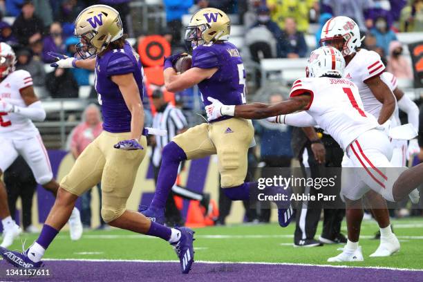 Sean McGrew of the Washington Huskies runs for a touchdown against the Arkansas State Red Wolves during the first quarter at Husky Stadium on...