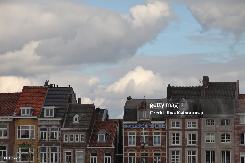 Dutch houses against cloudy blue sky