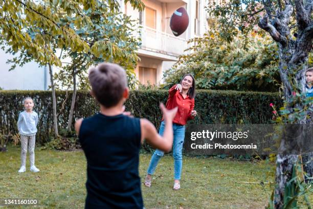 playing football - throwing football stock pictures, royalty-free photos & images