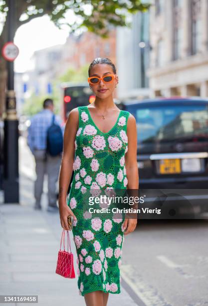 Guests outside waring green sheer dress with floral print yuhan wang during London Fashion Week September 2021 on September 18, 2021 in London,...