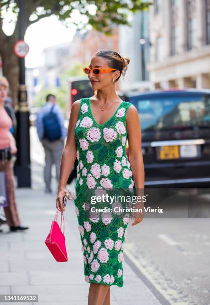 Guests outside waring green sheer dress with floral print yuhan wang during London Fashion Week September 2021 on September 18, 2021 in London,...