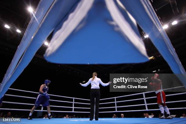 The competitors are called forward to start the Women's middle weight boxing match between Dariga Shakimova of Kazakhstan and Andreia Baneira of...