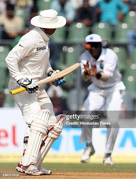 Virendra Sehwag of India looks on as he is being caught out by West Indies captain Darren Sammy during the last day of the third test match between...