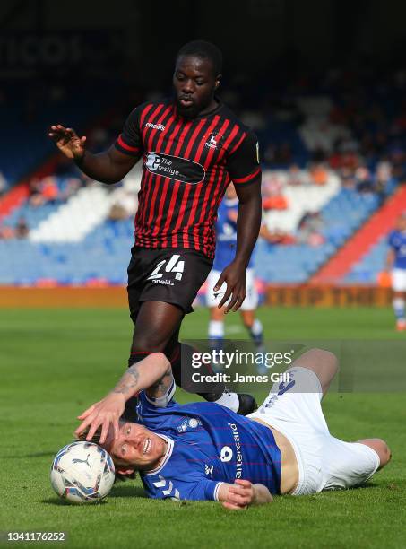 Olufela Olomola of Hartlepool and Carl Piergianni of Oldham Athletic battle for possession during the Sky Bet League Two match between Oldham...