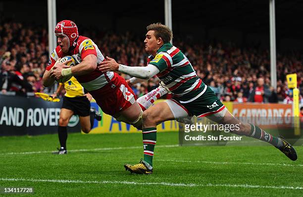 Tigers flyhalf Toby Flood cant stop Gloucester captain Luke Narraway from scoring during the Aviva Premiership match between Gloucester and Leicester...
