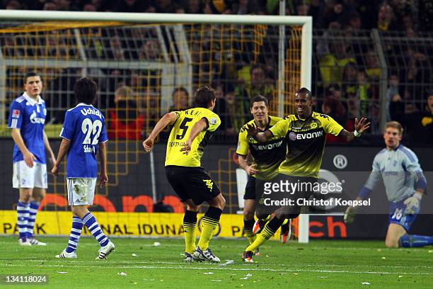Felipe Santana of Dortmund celebrates the second goal with Robert Lewandowski and Sebastian Kehl of Dortmund during the Bundesliga match between...