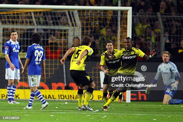 Felipe Santana of Dortmund celebrates the second goal with Robert Lewandowski and Sebastian Kehl of Dortmund during the Bundesliga match between...