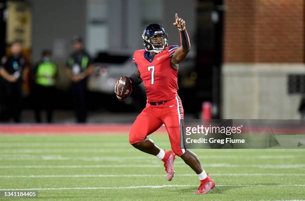 Malik Willis of the Liberty Flames rolls out of the pocket in the second half against the Old Dominion Monarchs at Williams Stadium on September 18,...