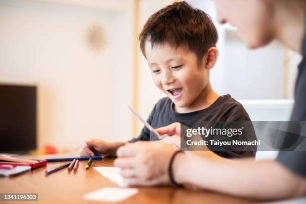 a five-year-old boy drawing with his mother using colored pencils - japan mom and son stock pictures, royalty-free photos & images