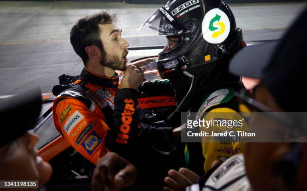Chase Elliott, driver of the Hooters Chevrolet, and Kevin Harvick, driver of the Subway Delivery Ford, have a heated conversation after an incident...