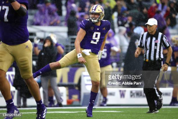 Dylan Morris of the Washington Huskies celebrates after throwing a touchdown pass against the Arkansas State Red Wolves during the second quarter at...