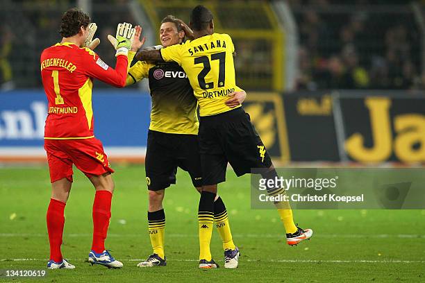 Roman Weidenfeller, Lukasz Piszczek and Felipe Santana of Dortmund celebrate the 2-0 victory after the Bundesliga match between Borussia Dortmund and...
