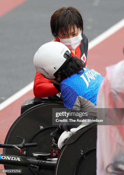 Tsubasa Kina and Wakako Tsuchida of Team Japan react after competing in the Athletics Women's Marathon - T54 on day 12 of the Tokyo 2020 Paralympic...