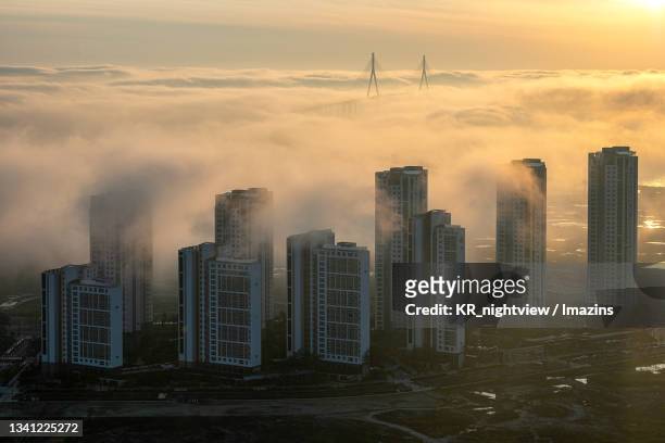 aerial view of songdo with cloud, south korea - songdo ibd stock pictures, royalty-free photos & images