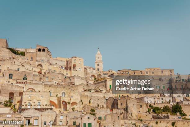 the sassi of matera city with church during morning light. - matera stock pictures, royalty-free photos & images