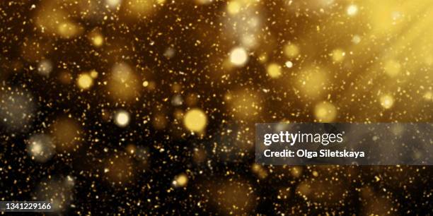 golden glittering background - goldstrahlen stock-fotos und bilder