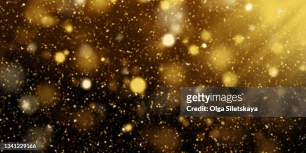 golden glittering background - glitter black background stockfoto's en -beelden