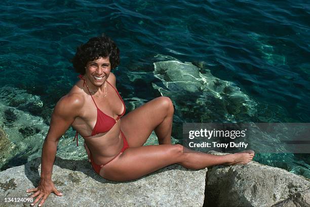 Fatima Whitbread of Great Britain relaxes in a bikini by the sea during training on 10th March 1983 in Limassol, Cyprus.