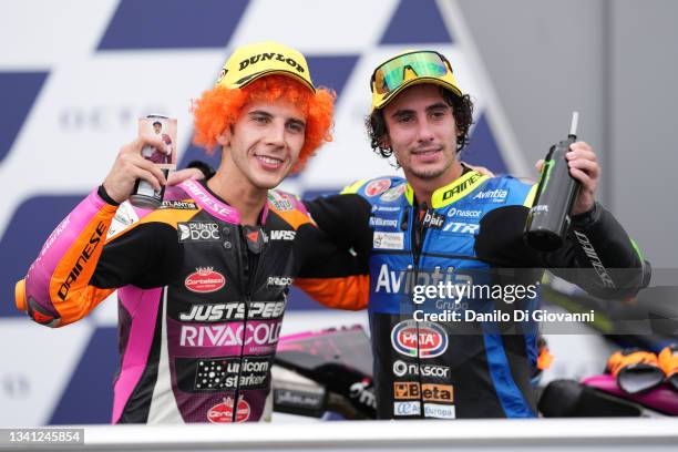 Andrea Migno of Italy and Rivacold Snipers Team and Niccolò Antonelli of Italy and Avintia VR46 celebrate the second and third palceof the Moto3 Race...