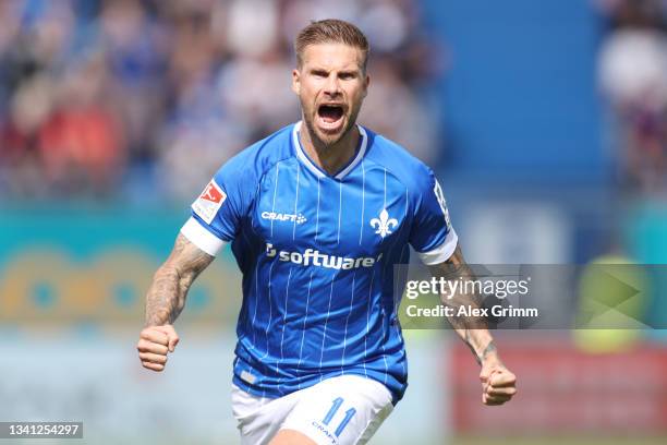 Tobias Kempe of Darmstadt celebrates his team's first goal during the Second Bundesliga match between SV Darmstadt 98 and SG Dynamo Dresden at...