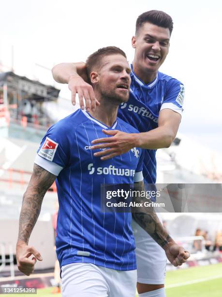 Tobias Kempe of Darmstadt celebrates his team's first goal with teammate Mathias Honsak during the Second Bundesliga match between SV Darmstadt 98...