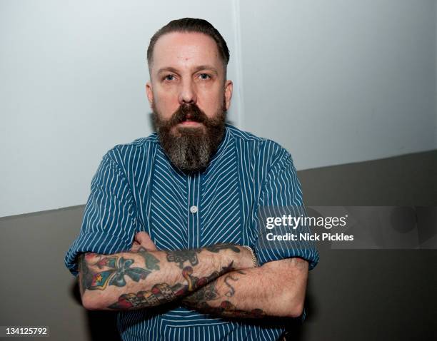 Andrew Weatherall poses backstage at the House of Fun Weekender at Butlins Holiday Centre on November 25, 2011 in Minehead, England.