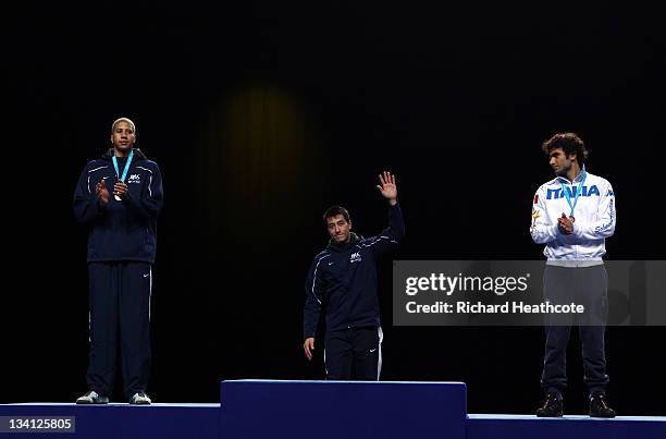 Miles Chamley-Watson of the USA , Gerek Meinhardt of the USA and Tommaso Lari of Italy pose on the medal rostrum after the final of the Men's Foil...