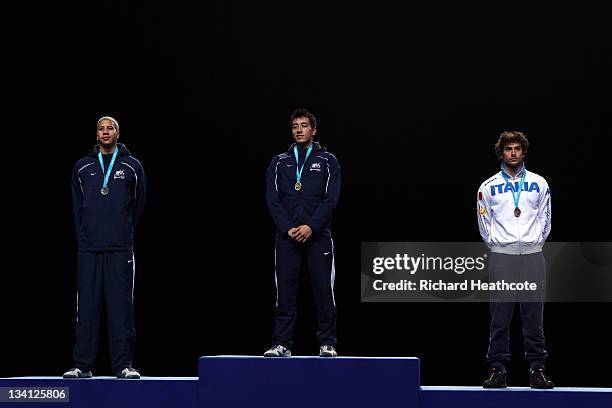 Miles Chamley-Watson of the USA , Gerek Meinhardt of the USA and Tommaso Lari of Italy pose on the medal rostrum after the final of the Men's Foil...