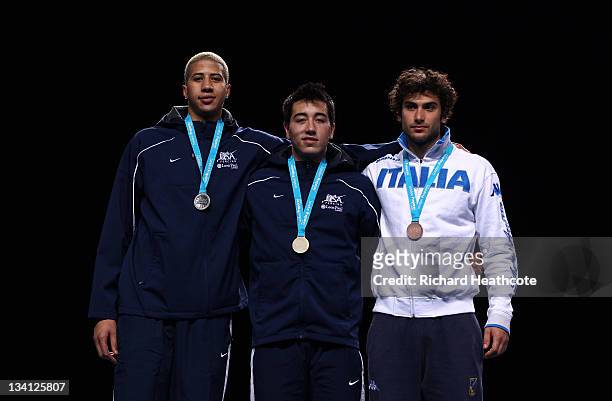 Miles Chamley-Watson of the USA , Gerek Meinhardt of the USA and Tommaso Lari of Italy pose on the medal rostrum after the final of the Men's Foil...