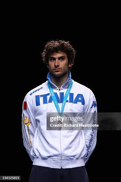 Tommaso Lari of Italy poses on the medal rostrum after the final of the Men's Foil Individual at the Fencing Invitational, part of the London...