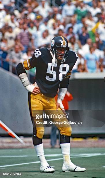 Linebacker Jack Lambert of the Pittsburgh Steelers looks on from the field during a National Football League game at Three Rivers Stadium in 1978 in...