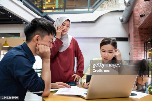 business people under pressure at work desk - islamic finance stock pictures, royalty-free photos & images